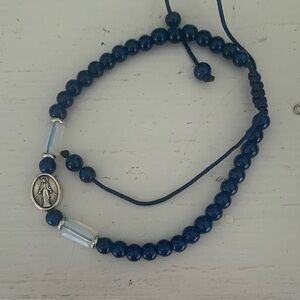 Blue Beaded Bracelet with Silver Jesus medal.  Adjustable